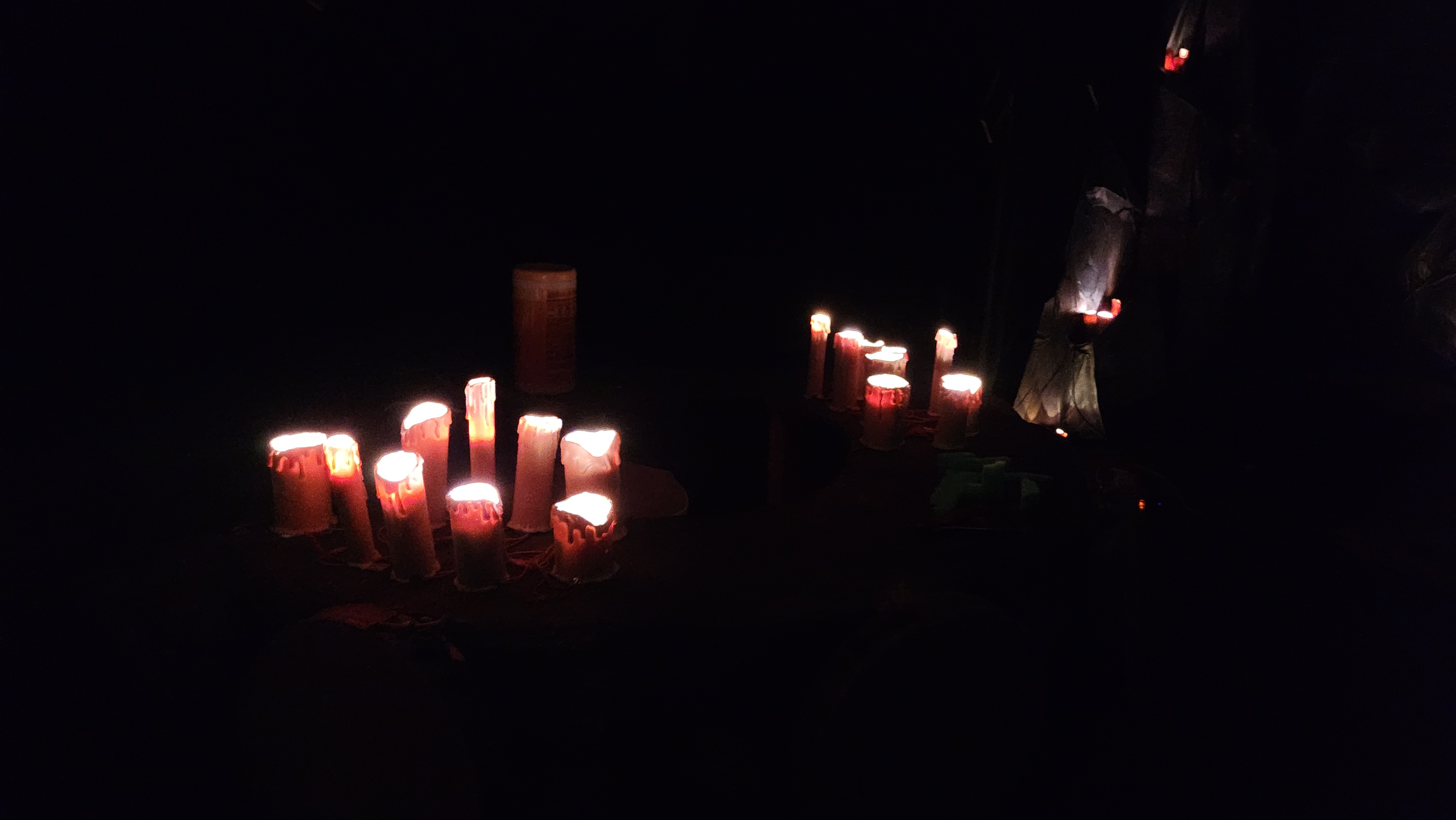 Candles lit up in the dark
